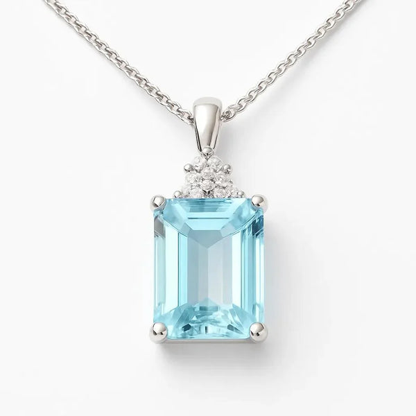 Brisbane Jeweller white gold pendant with emerald-cut blue gemstone and diamond cluster