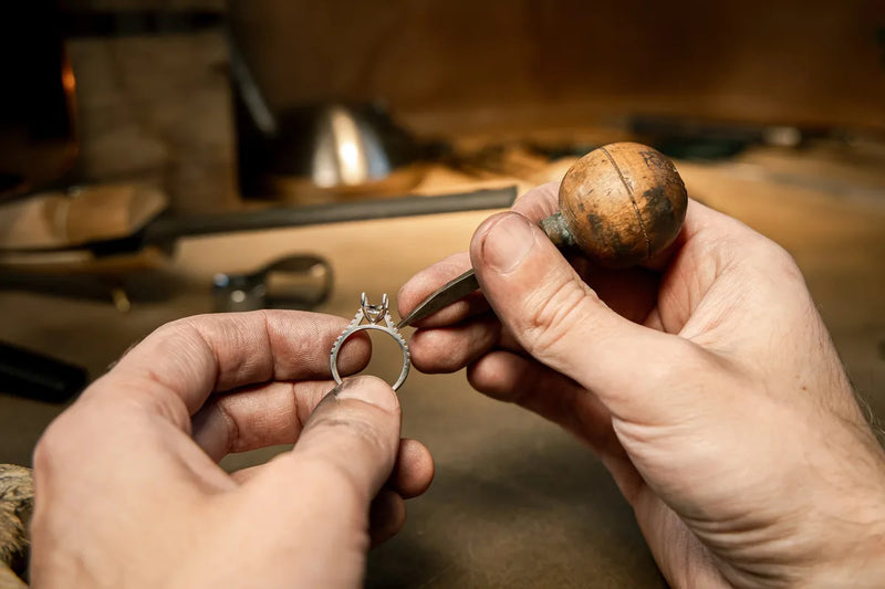 Jeweller setting a diamond during custom ring design